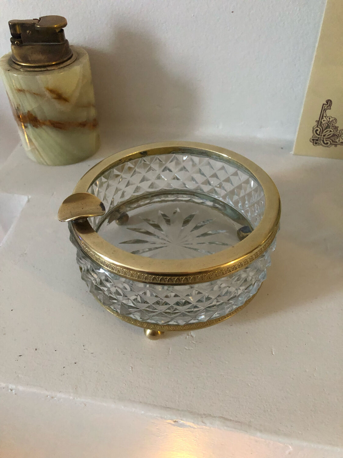 Crystal ashtray and brass