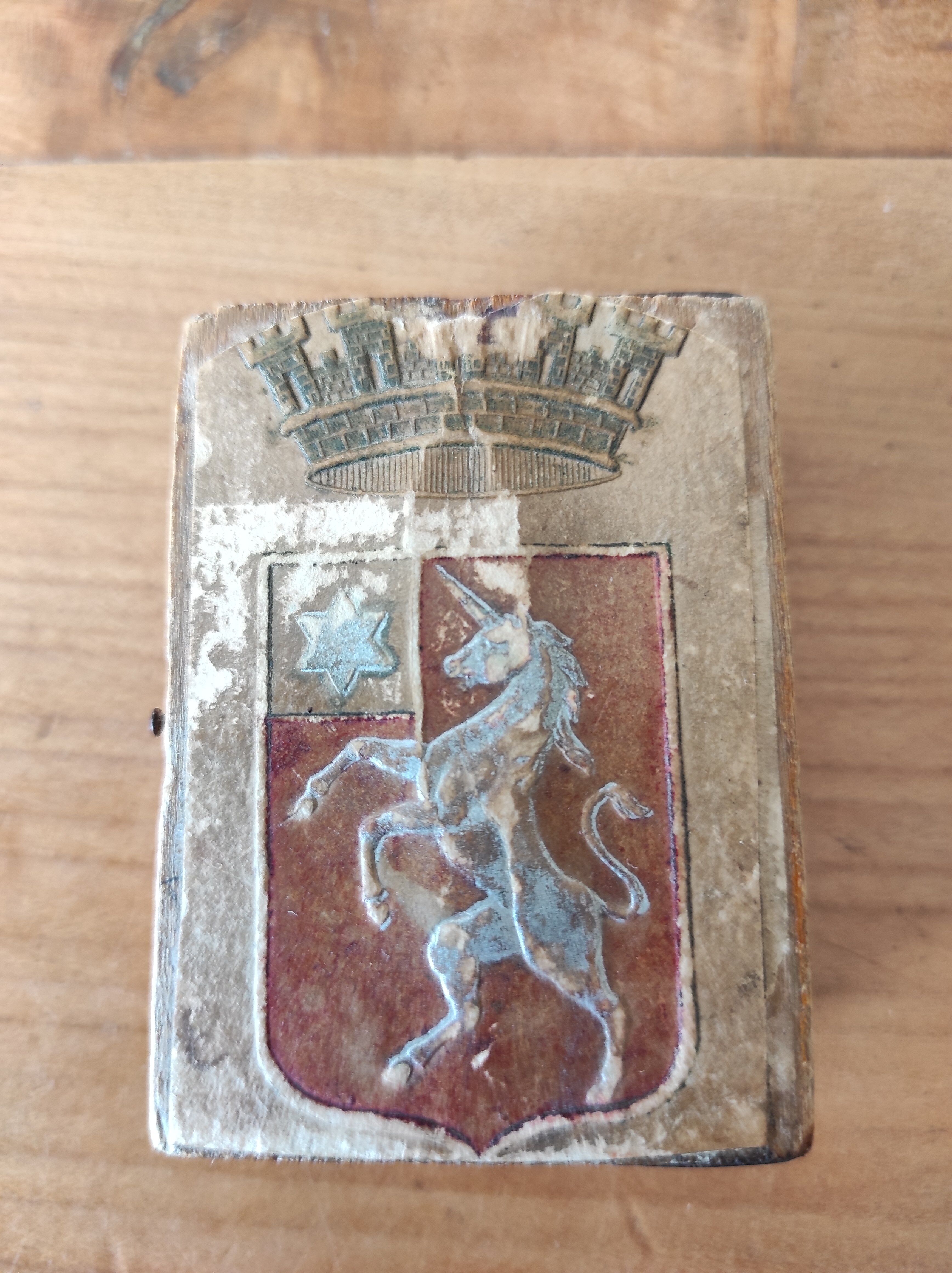Wooden box decorated badge and unicorn