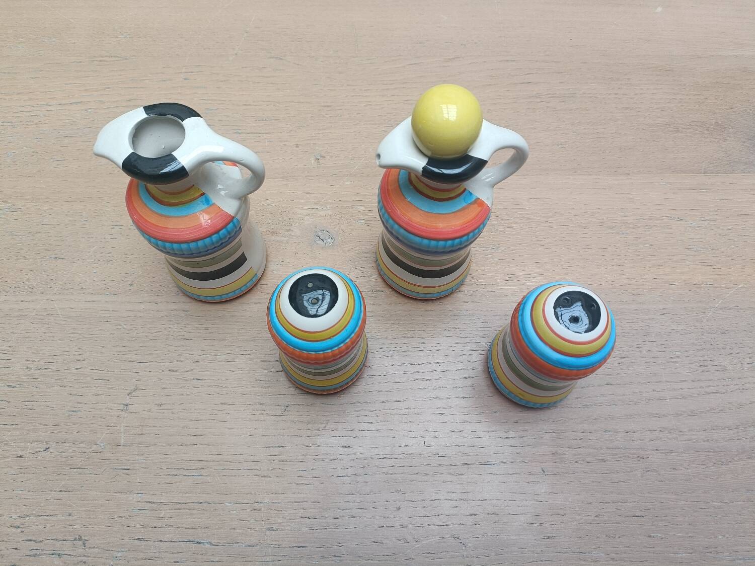 Vinegar and oil set, salt shaker and pepper shaker.