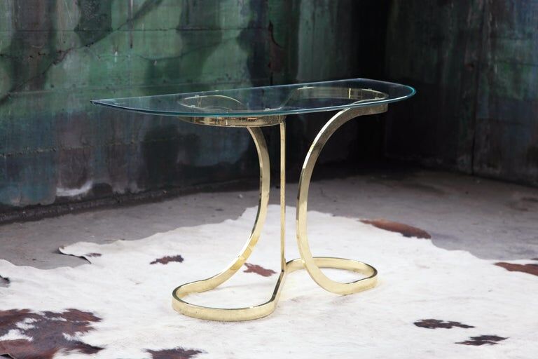 Brass ribbon console table Design Institute of America
