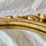 Old oval mirror in gilded resin - baroque style - 73 cm