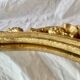Antique oval mirror in gold leaf resin - baroque style - 73 cm