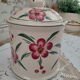 Vintage beige ceramic lid jar decorating pink flowers