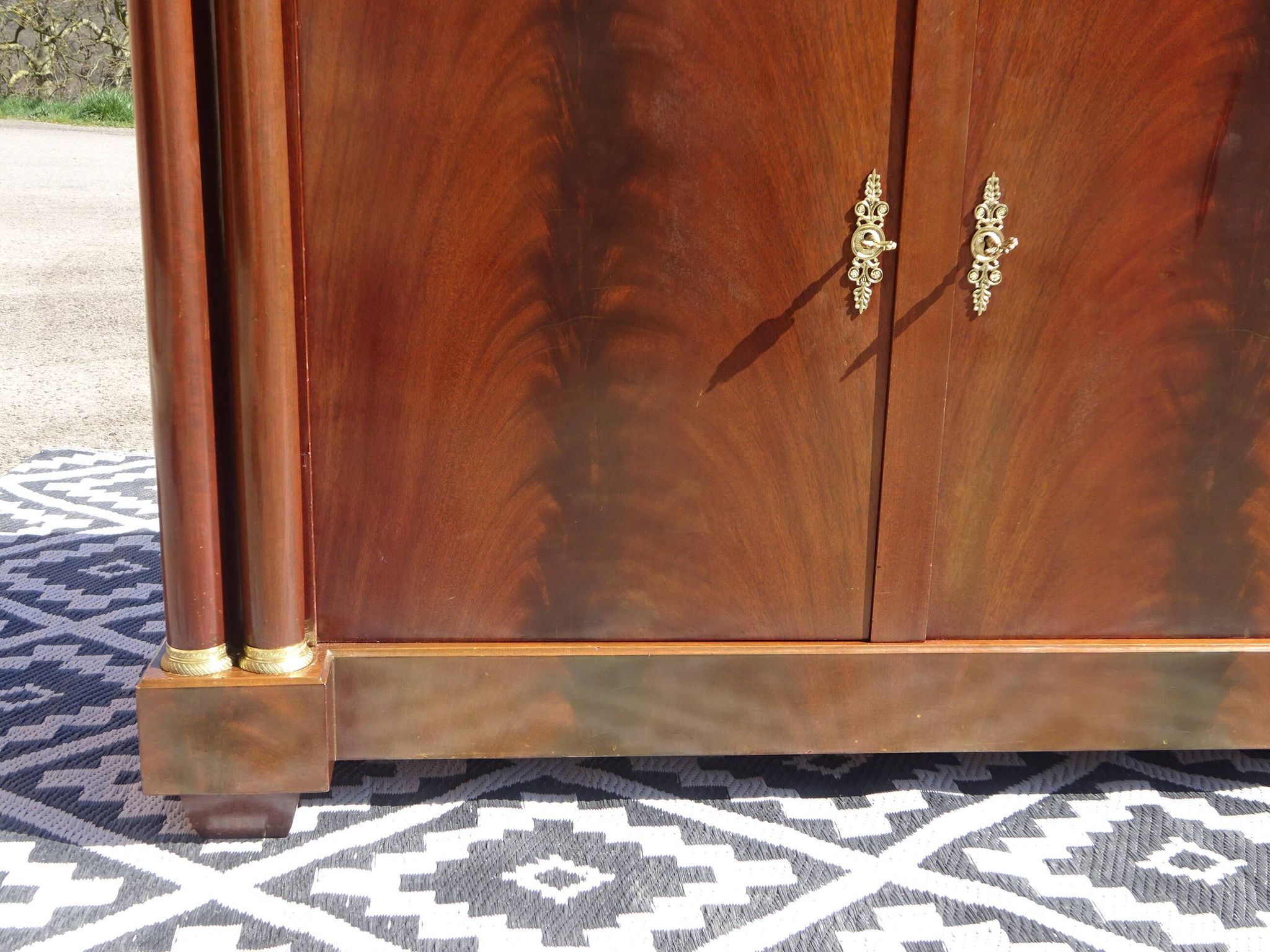 Flamed mahogany enfilade with sea green marble in Empire style.