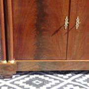 Flamed mahogany enfilade with sea green marble in Empire style.