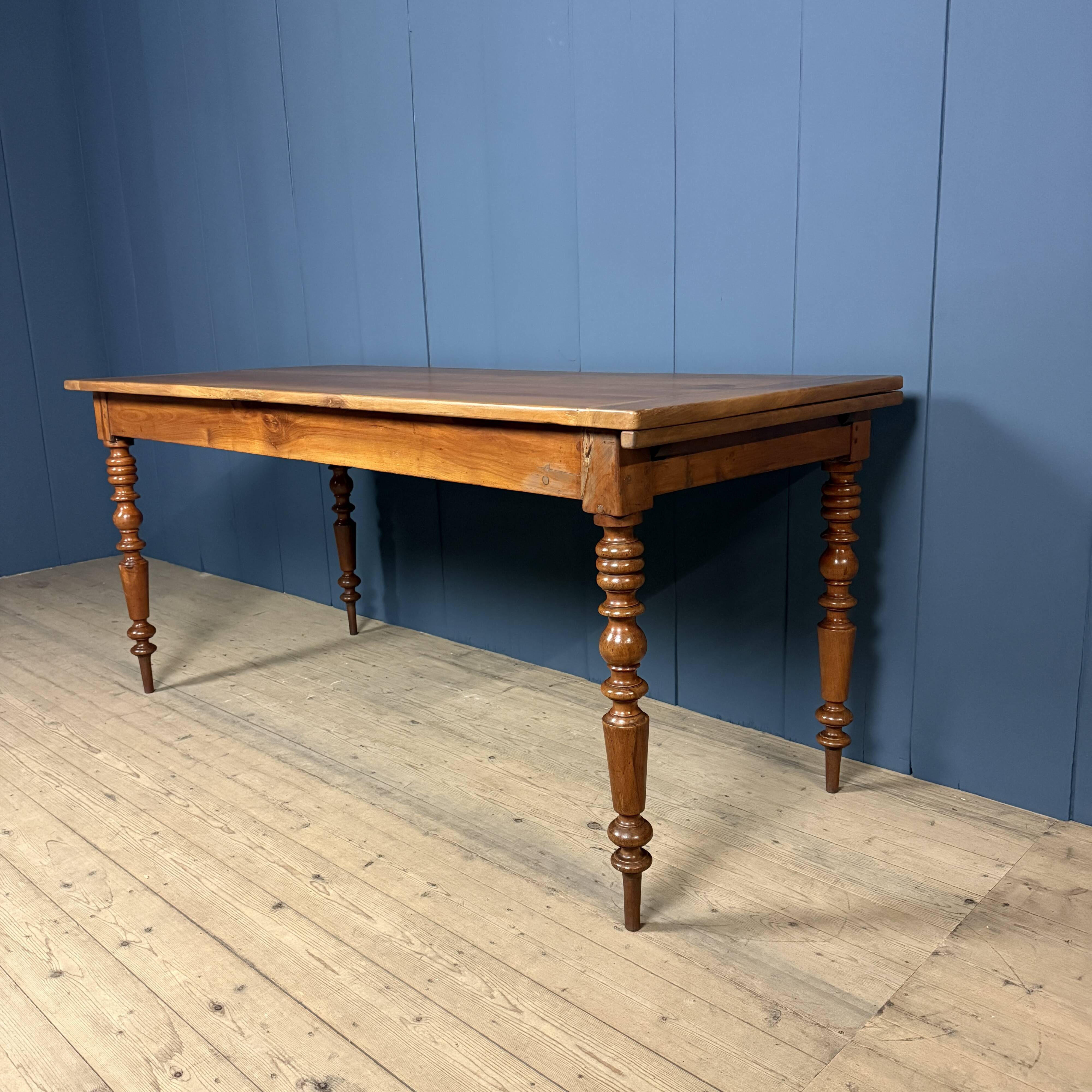 Antique cherry wood dining table from France.