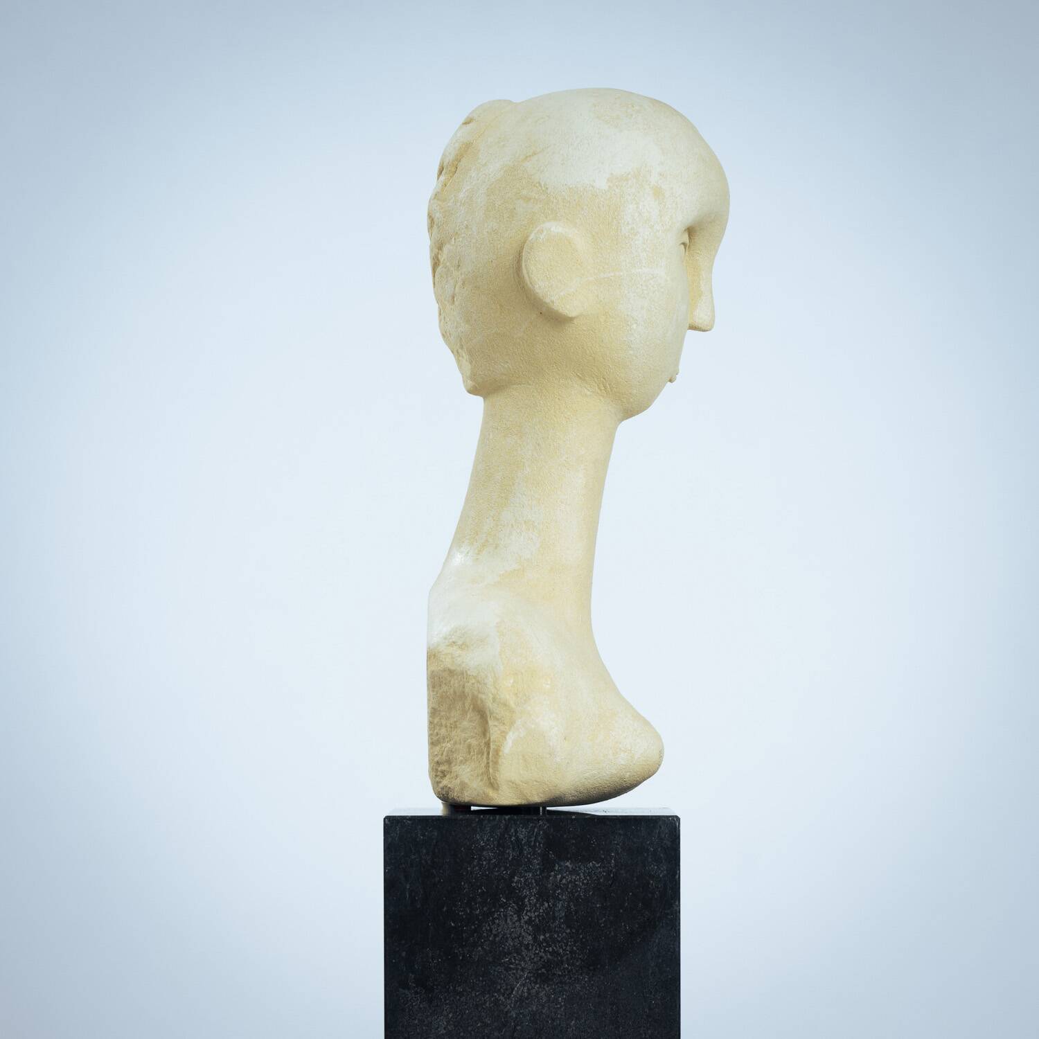 Modernist bust sculpture of a woman in sandstone