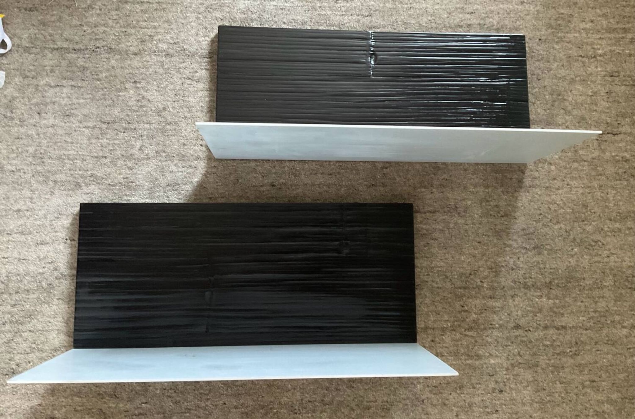 Pair of contemporary shelves in steel and stained wood