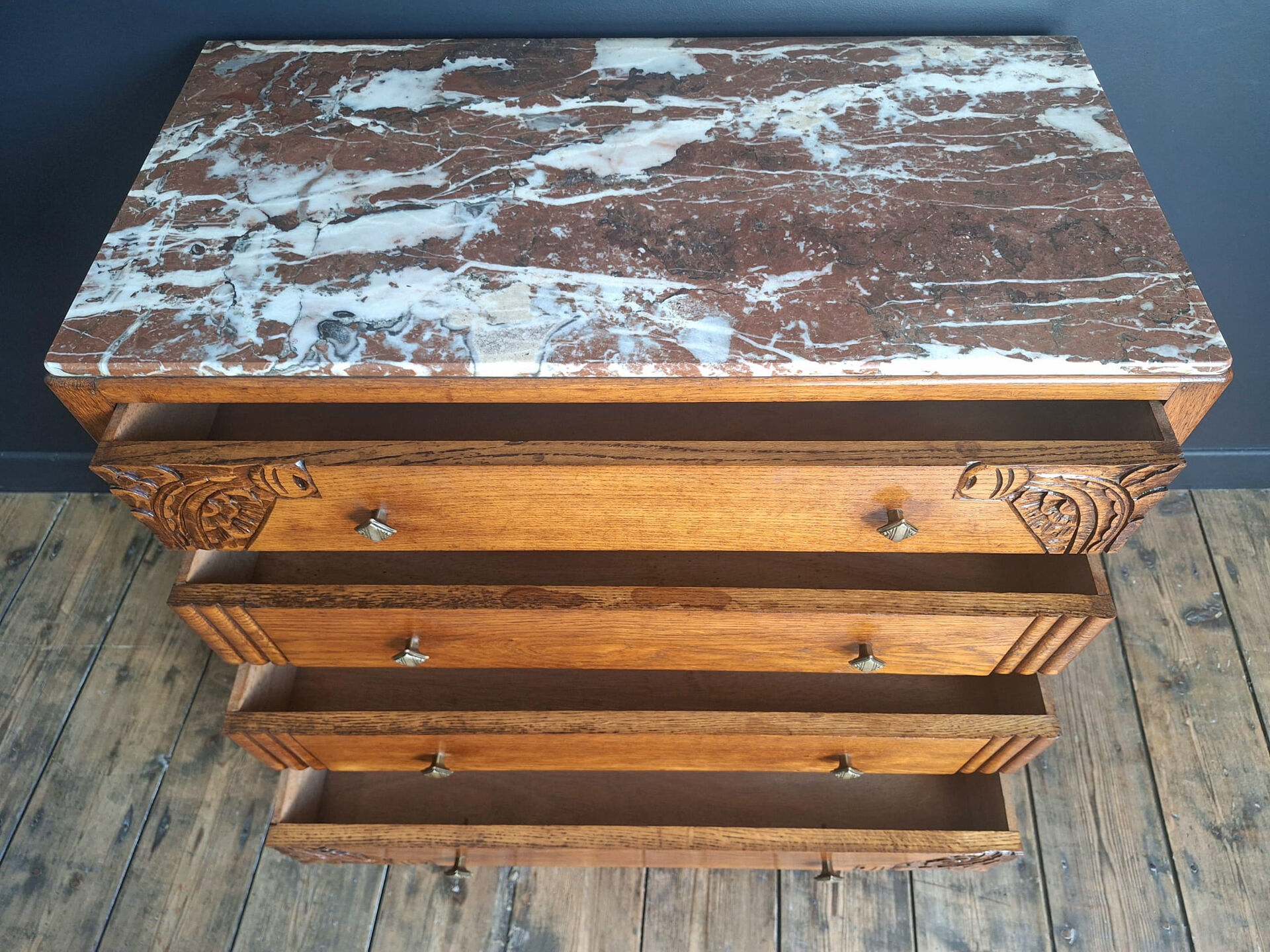 Art Deco commode with marble top, vintage antique furniture.
