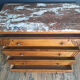 Art Deco commode with marble top, vintage antique furniture.