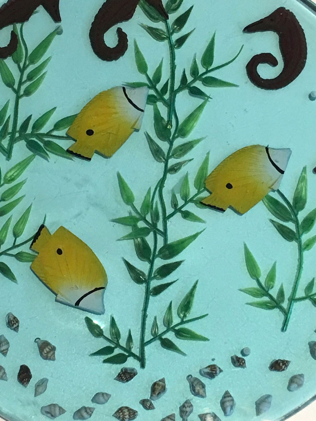 Set of 4 resin trays, inlaid with seahorses, fish, seaweed, and shells.