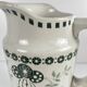 Antique earthenware pitcher, green floral decoration, fine ironstone from the late 19th to early 20th century.