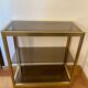 Regency style console table, in gilded metal and smoked glass