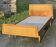 Read a vintage wooden and cane bed, with compass legs – mattress 80 × 190 cm.