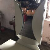 Mid-Century silver dressing table in glass and paint, central oval mirror, 1950s.