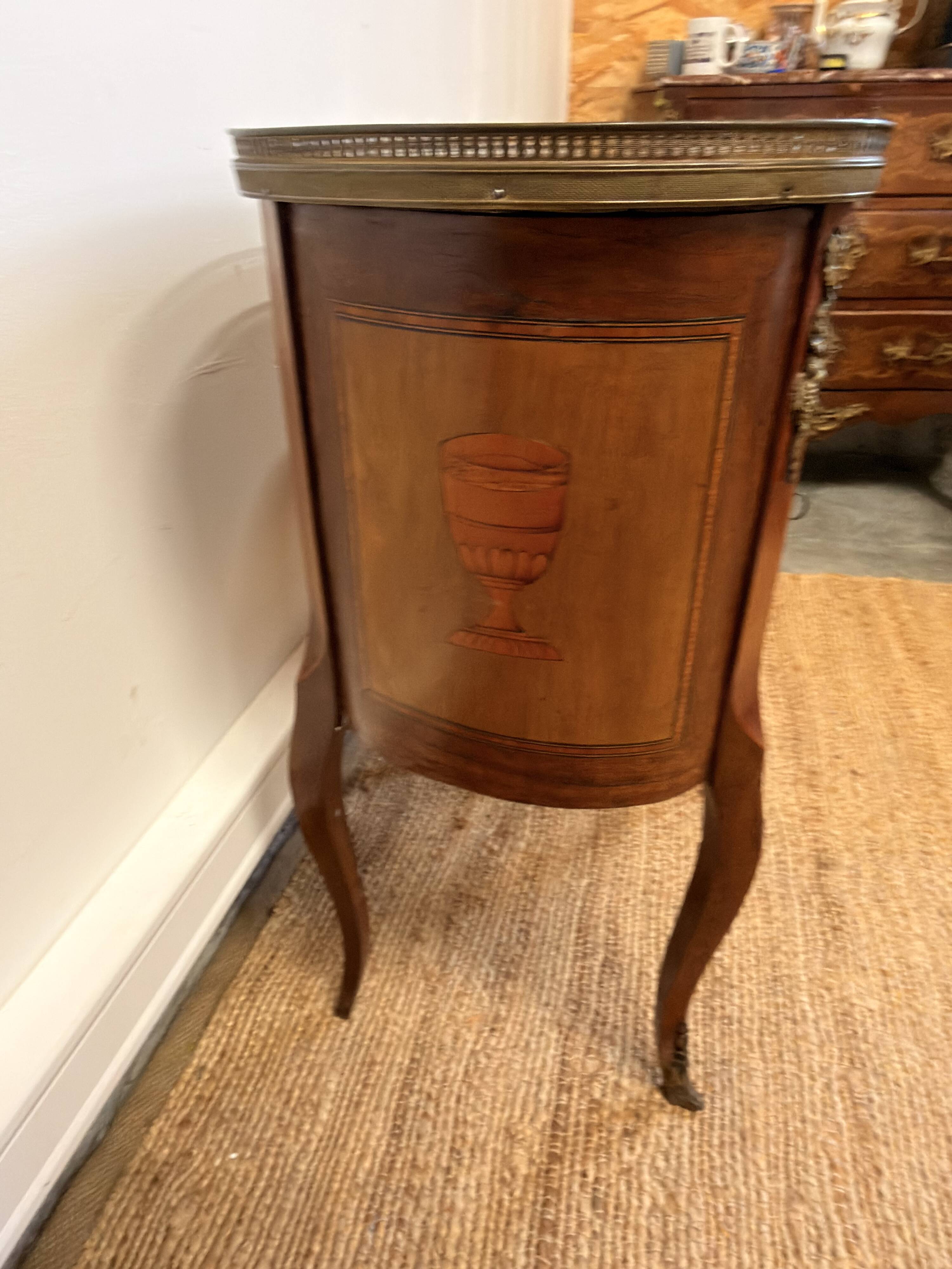 Transitional style side table, with a red marble top.