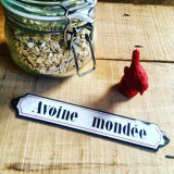 Ancient enamelplate of seed or grocery store. Furniture by trade. 1900s/1910s.