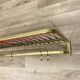 Coat rack with scoubidou shelf