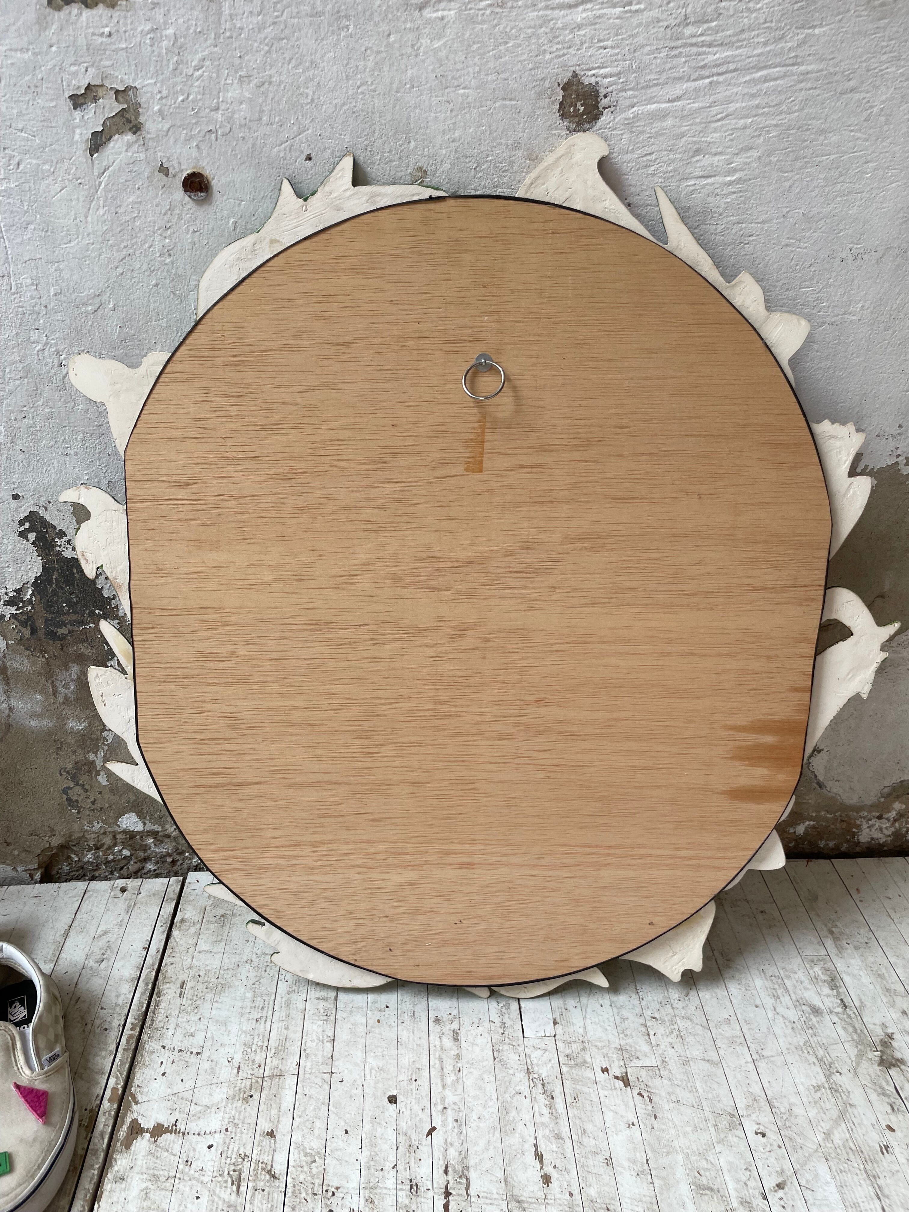 Oval ceramic mirror with flowers