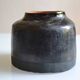 Ceramic vase with a signature fish to identify.