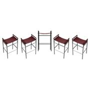 Set of 5 contemporary artisan bar stools in cognac leather and black rubber metal.