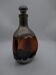 Vintage decanter in glass and tin.