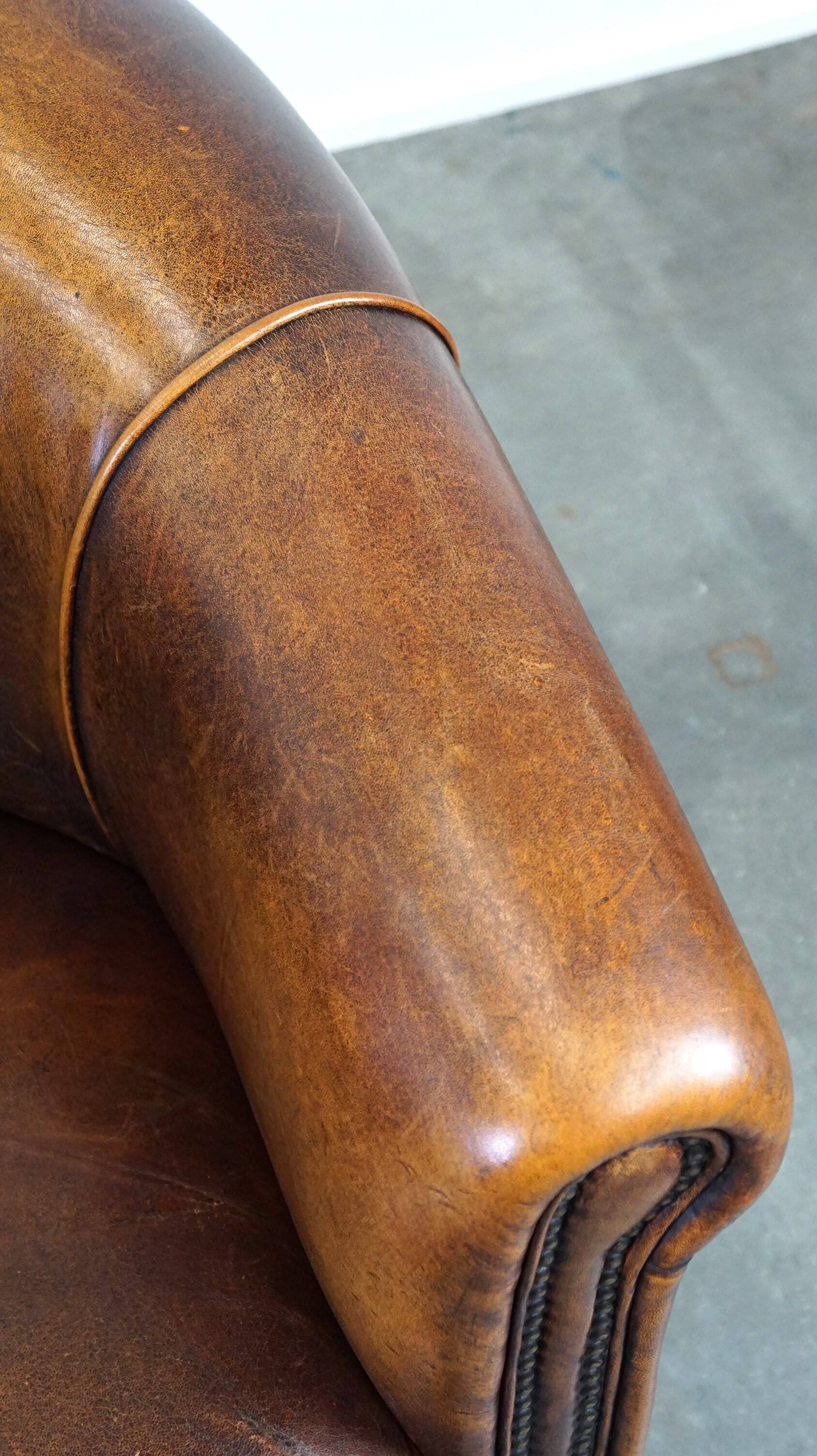 Charming, classy, and comfortable sheepskin leather club armchair