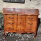 Louis XV style crossbow commode in cherry wood