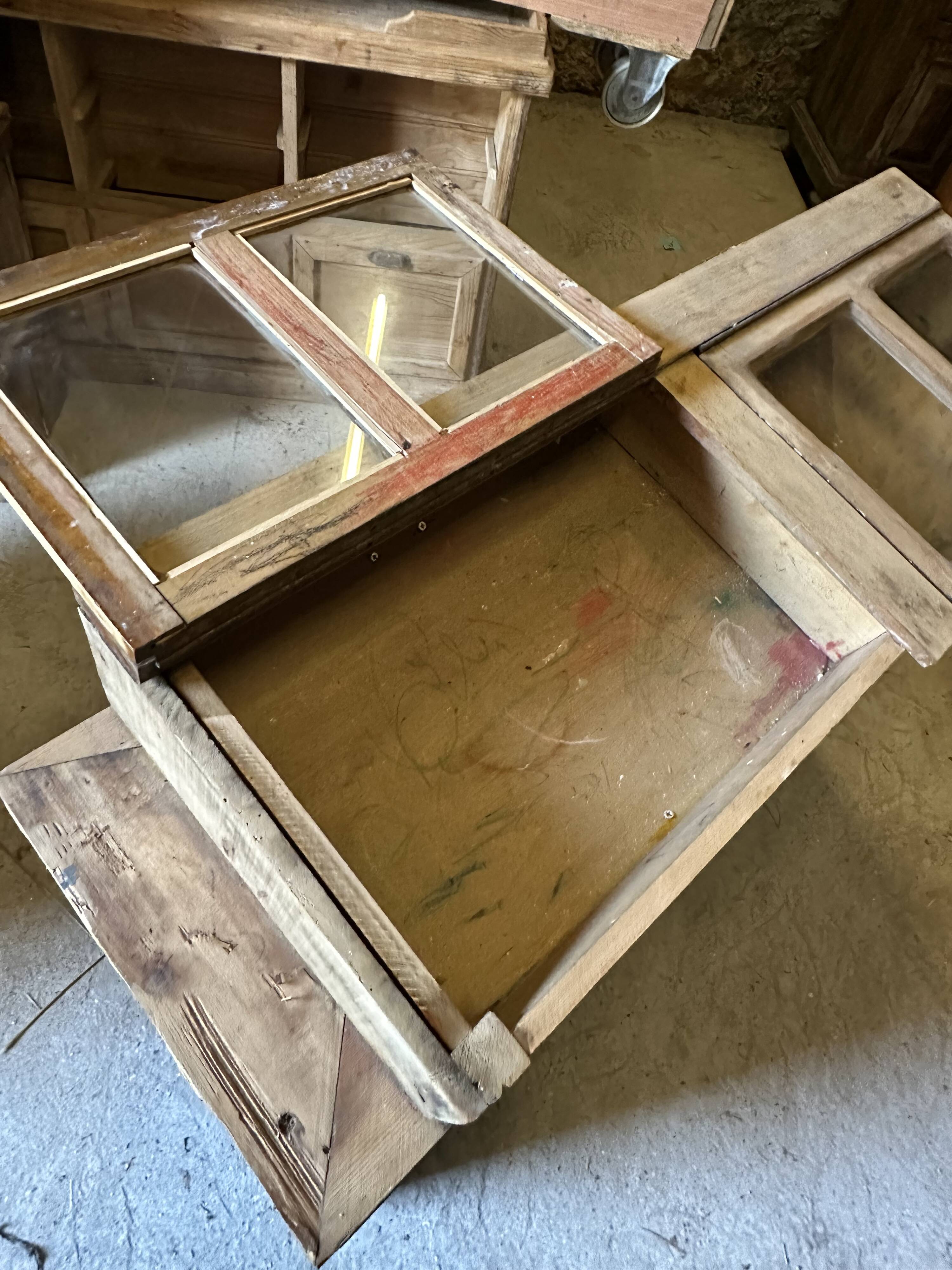 Showcase for boutique furniture, inclined boxes for presentation of collections on low sideboard