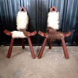 Pair of brutalist tripod chairs in wood and cowhide