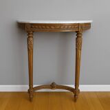 Half-moon console in Louis XVI style made of carved wood.