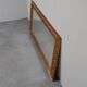 wall mirror in a decorative wooden frame.