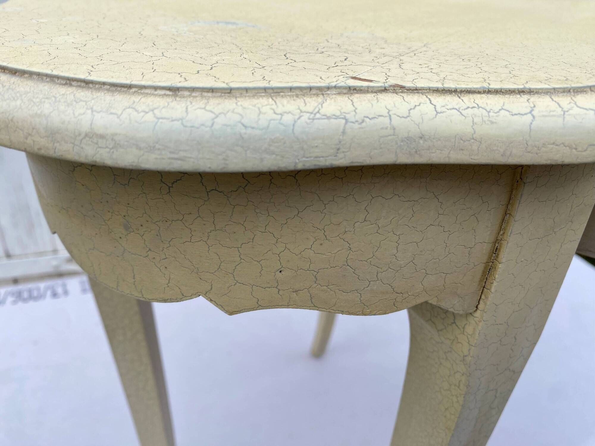 Eggshell-coloured drawer with a cracked effect side table.