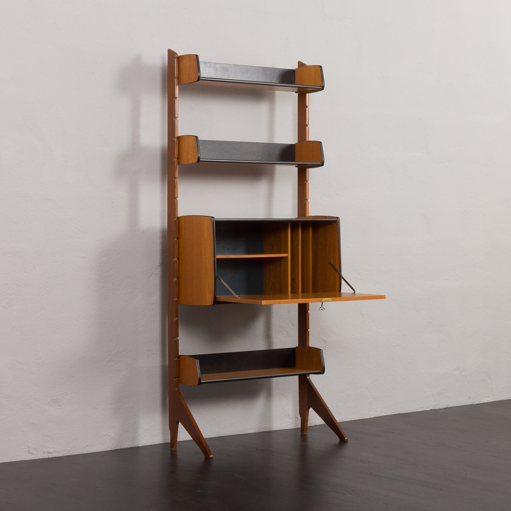 Scandinavian free standing vertical bookcase with a secrtetaire or home office wall unit model Ergo,