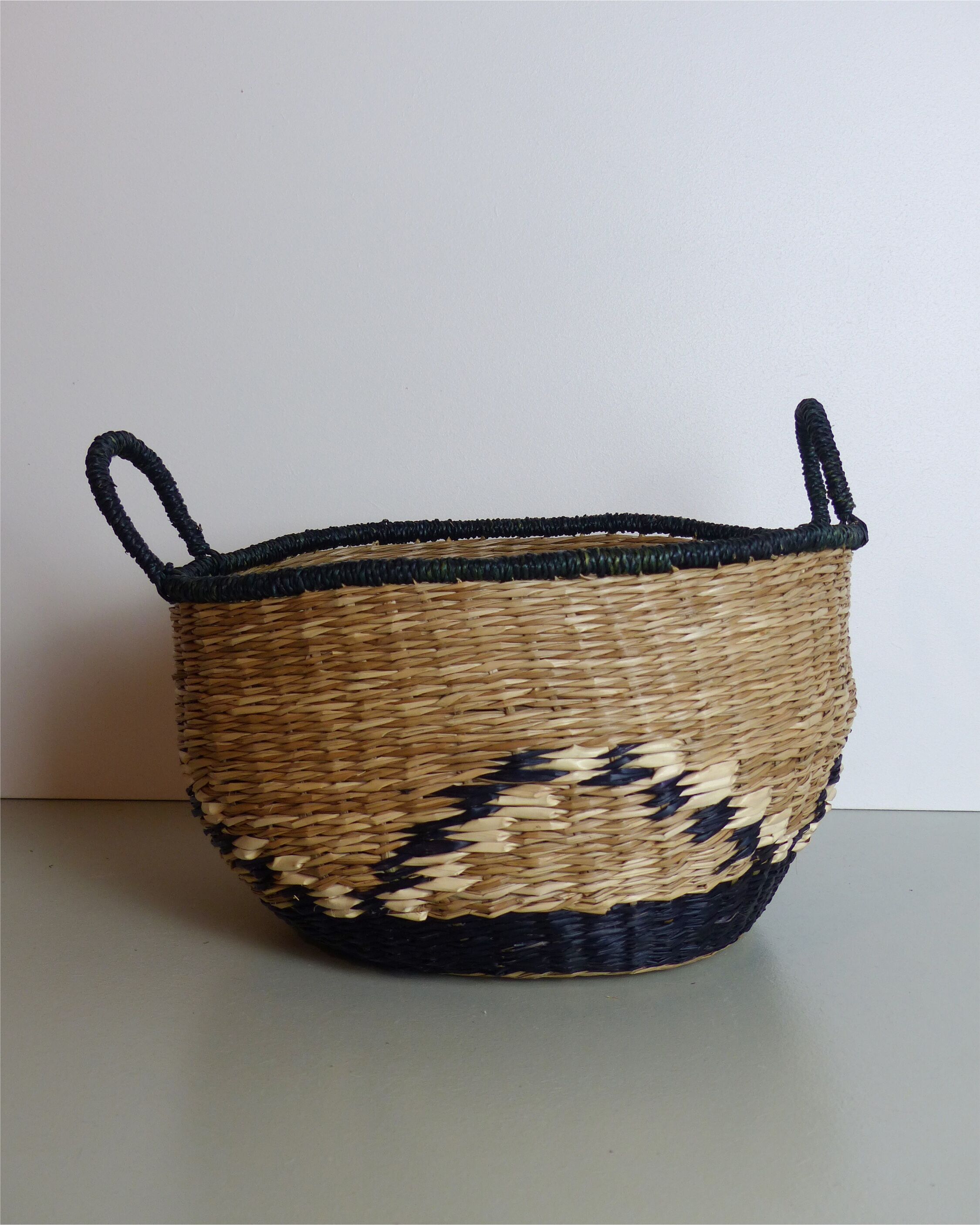 Vintage basket in black and beige raffia