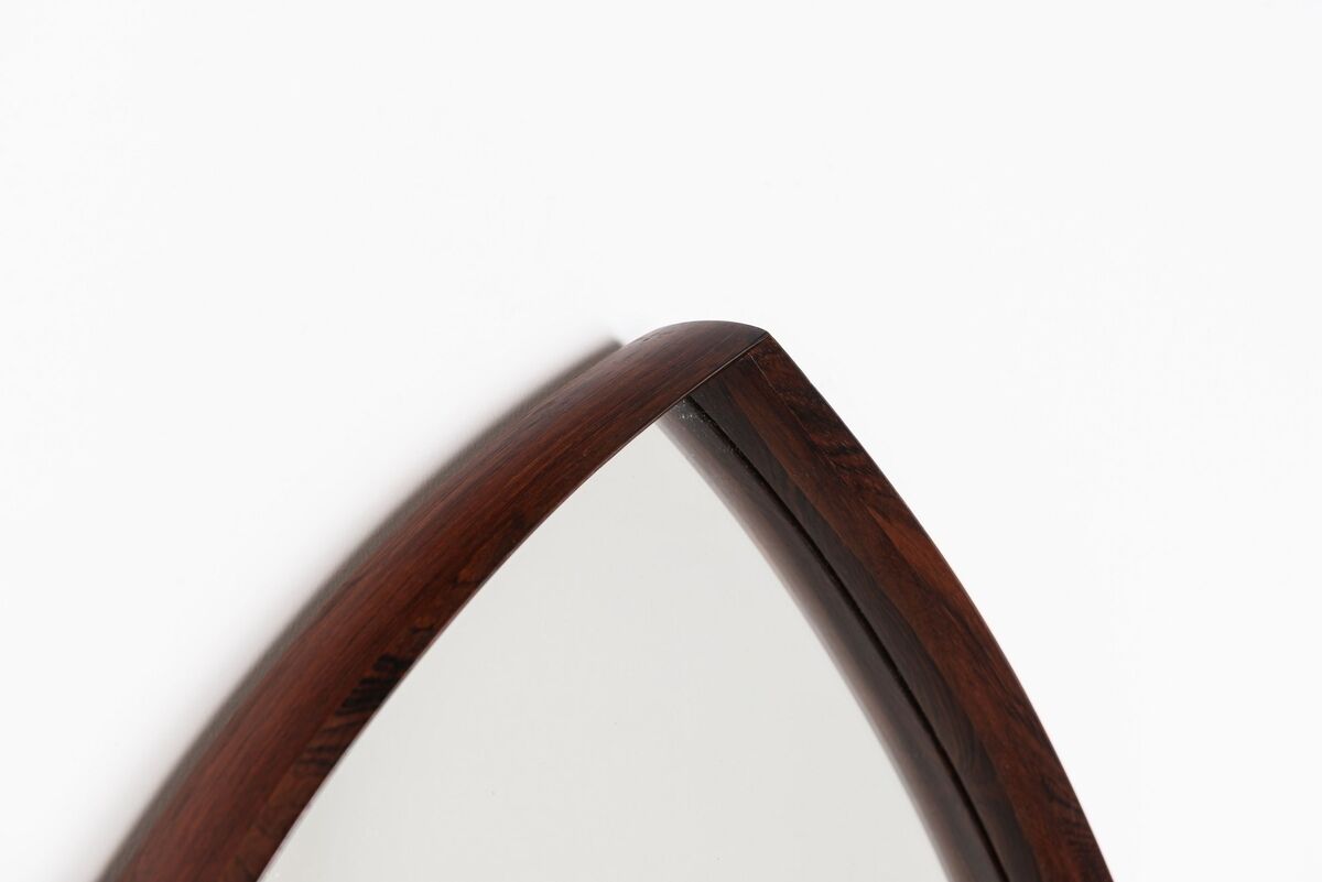 Thomas Poss Eferfolger wall mirror in rosewood triangular Denmark 1960