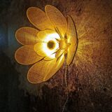 Flower wall light made of rattan and raffia petals