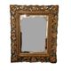 Miroir biseauté et bois sculpté