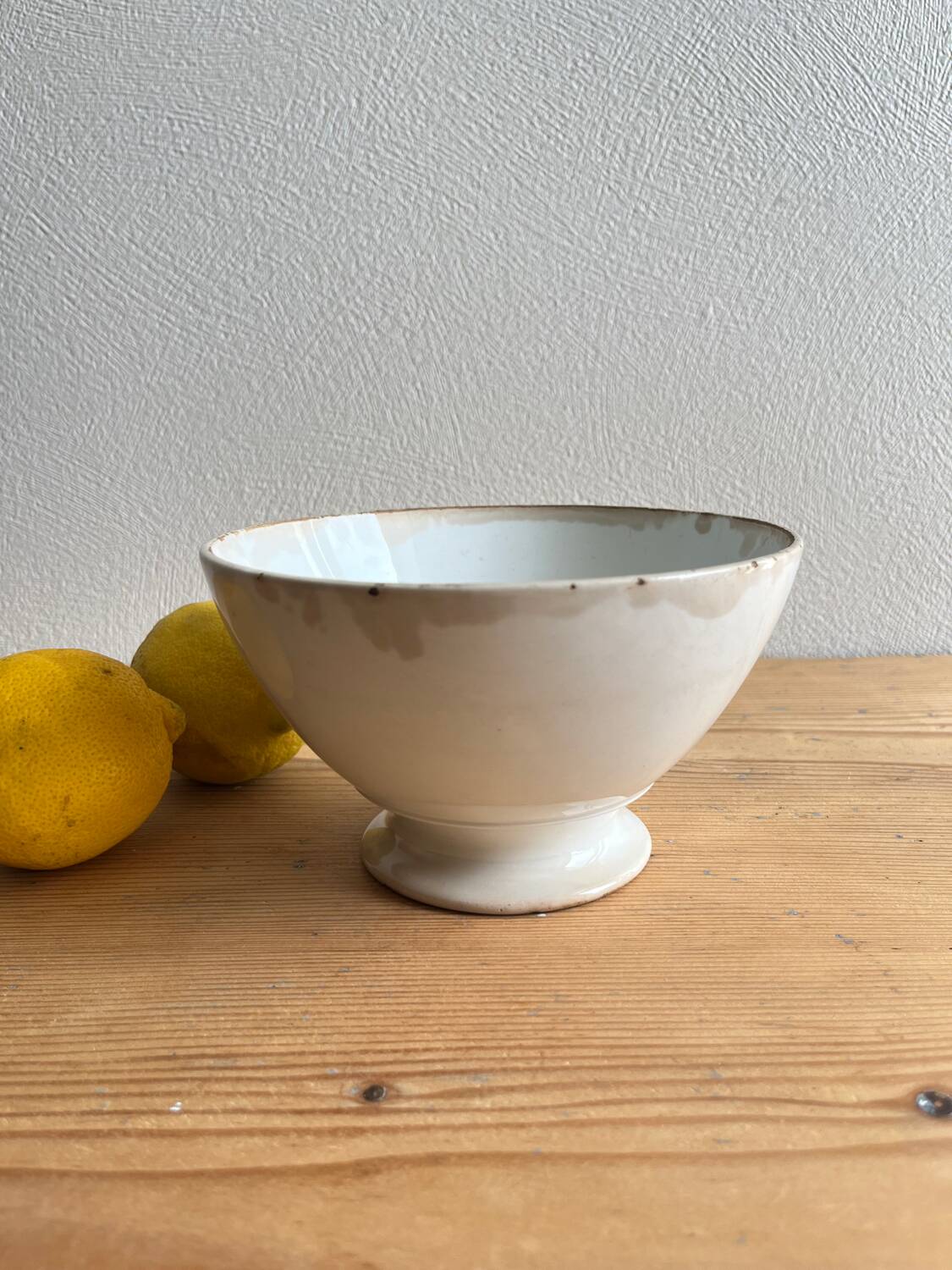 Old earthenware bowl on a pedestal, Badonviller, France.