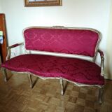 Louis XV style sofa in gilded wood and red pompadour fabric