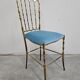 Mid-century Chiavari accent chair in solid brass with a plush seat.