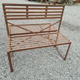 Wrought iron back-to-back garden bench