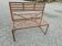 Wrought iron back-to-back garden bench