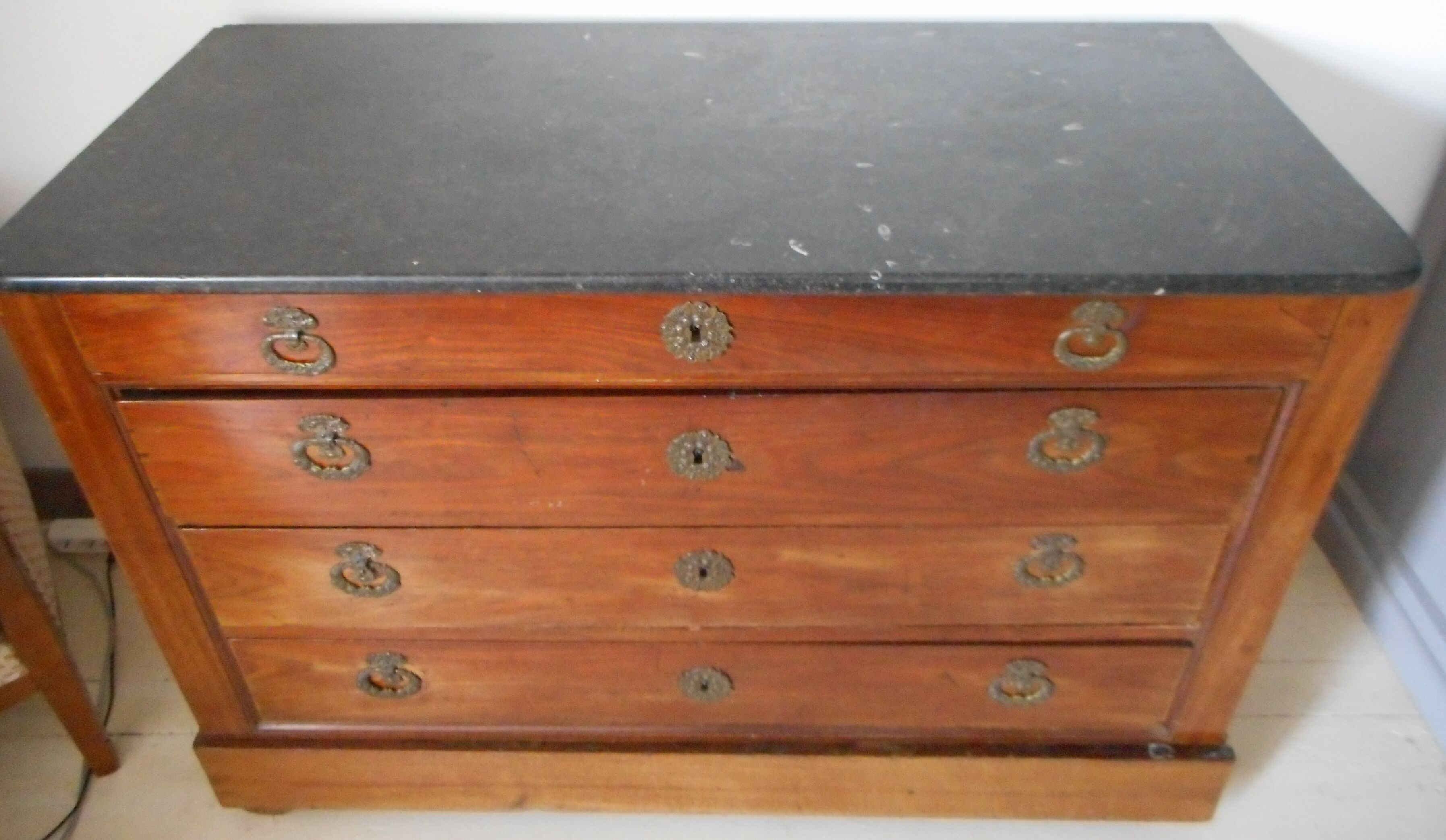 Old chest of drawers with black marble