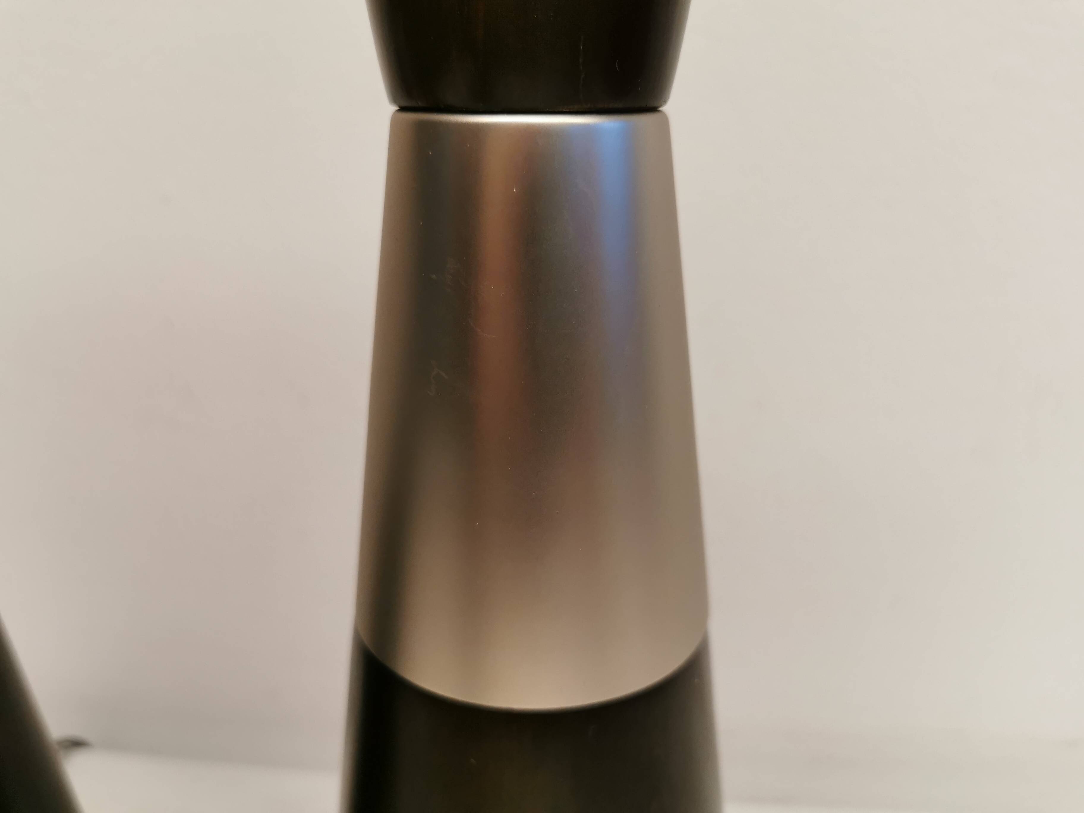 Two table lamps made of dark-stained wood with silver detail in the middle.