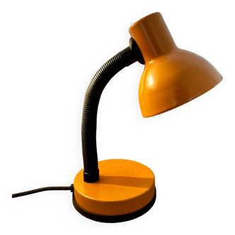 Orange articulated desk lamp