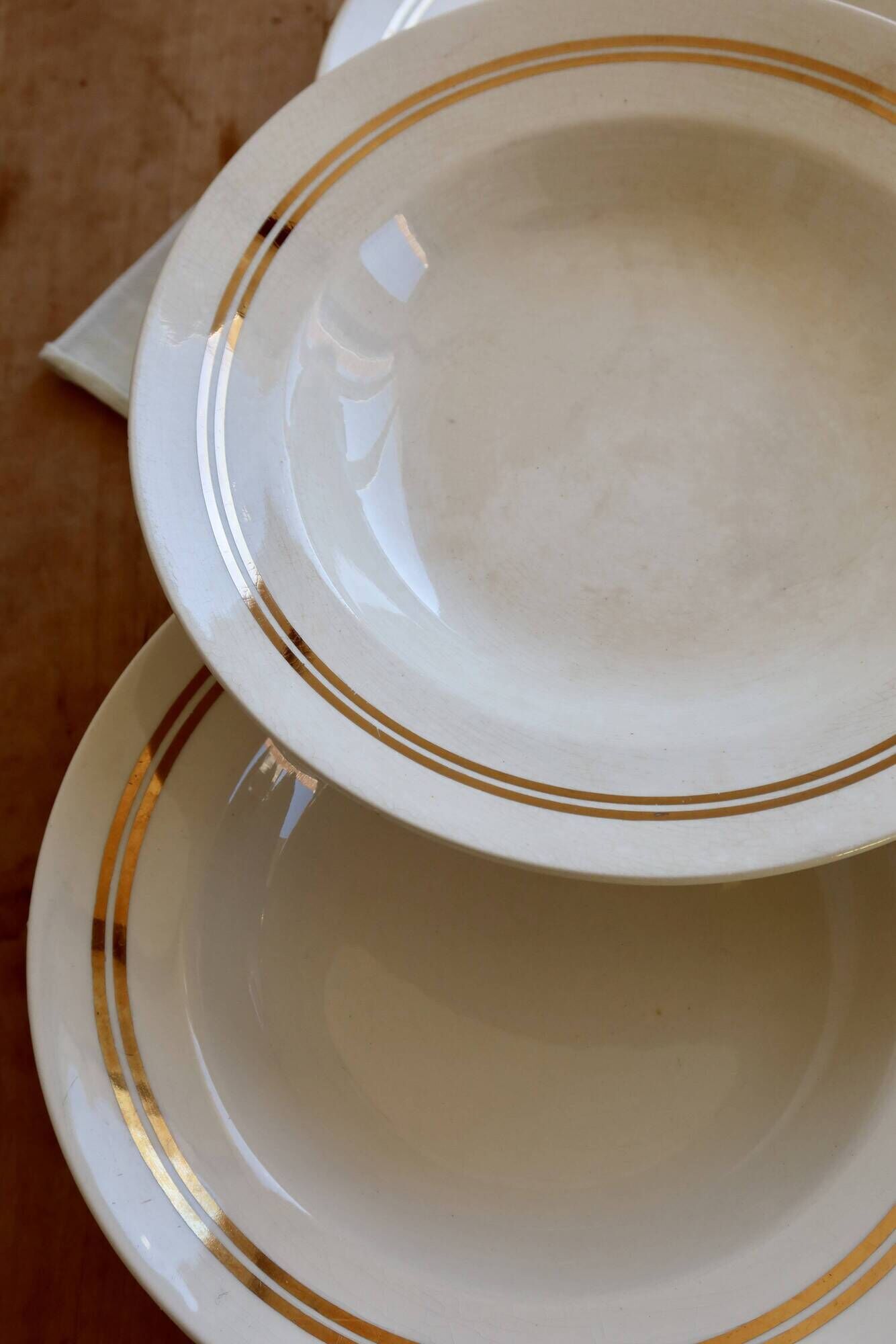 6 vintage ivory earthenware deep plates with double gold trim