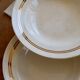 6 vintage ivory earthenware deep plates with double gold trim