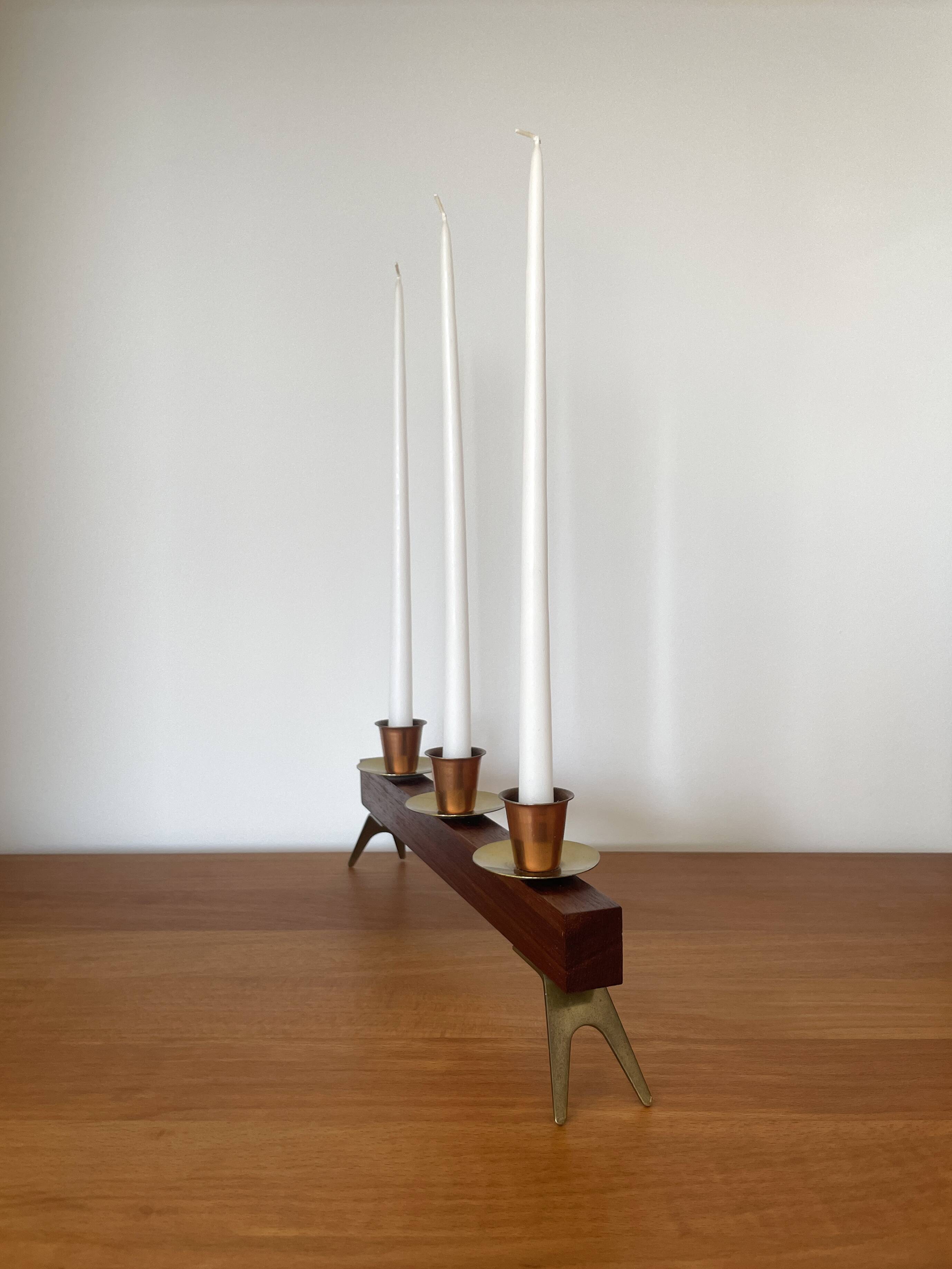 Modernist chandelier in teak and vintage brass.