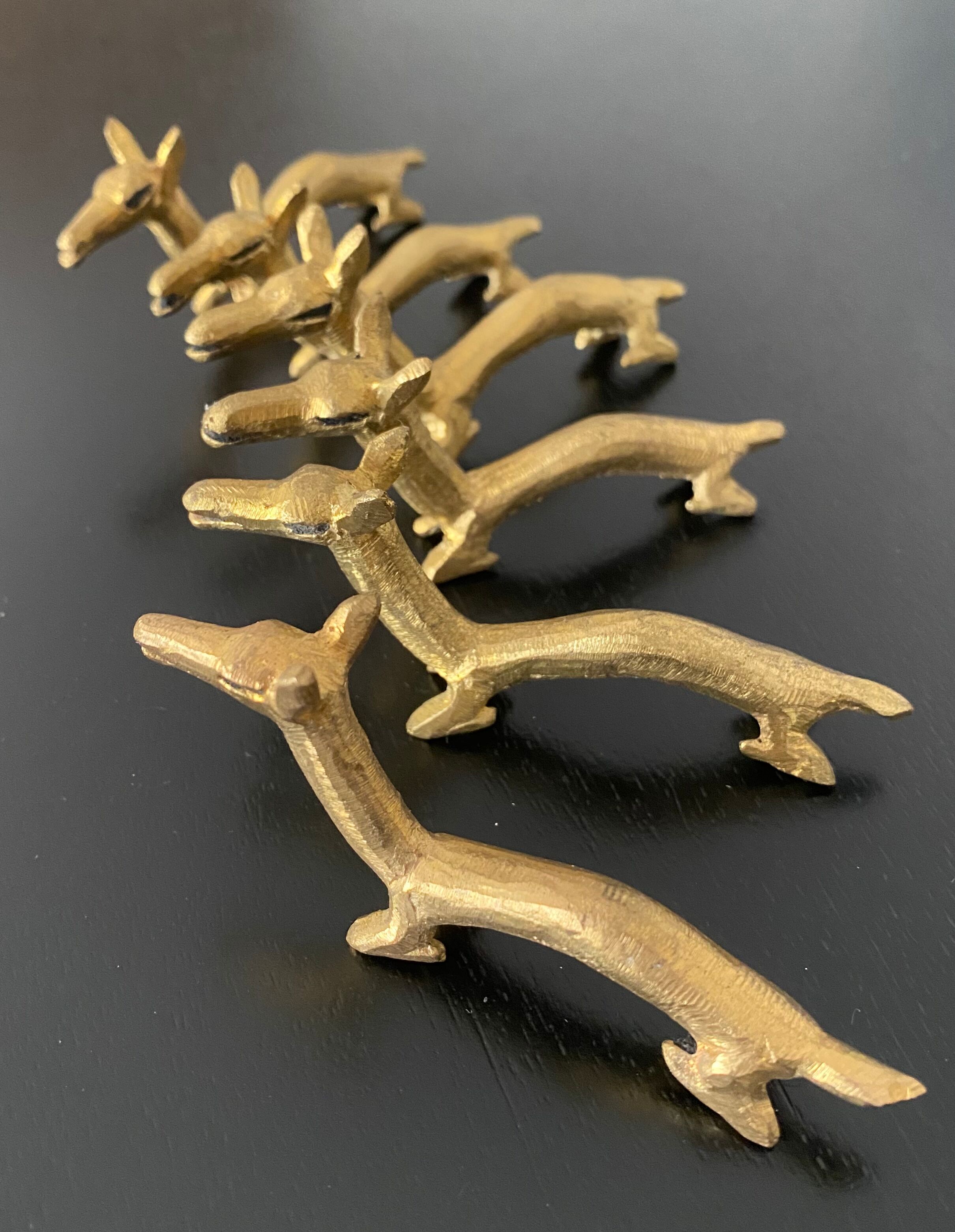 6 brass dromedary-shaped knife holders